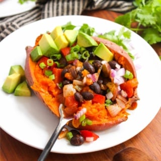 healthy stuffed sweet potato with black beans and avocado