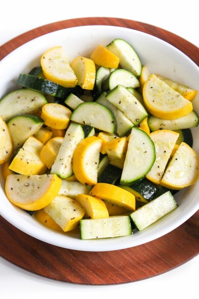 sliced zucchini and squash in a white bowl